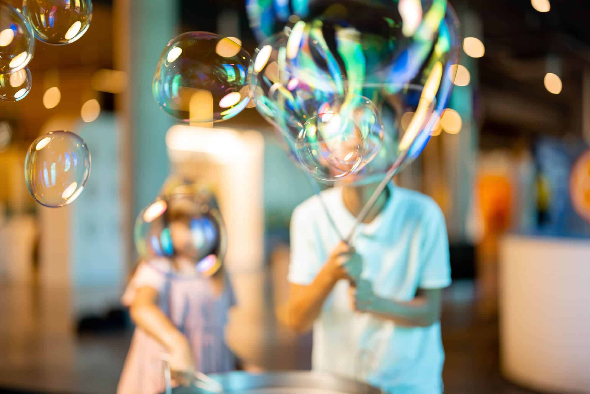 little-girl-and-boy-make-soap-bubbles-in-science-m-2024-01-10-16-05-41-utc.jpeg